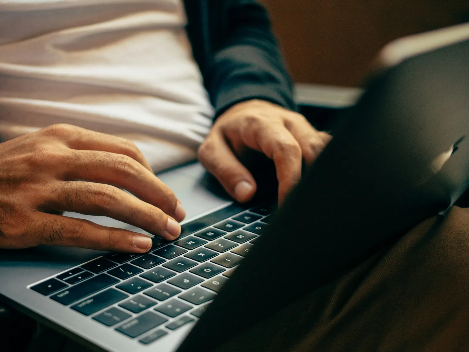 a person typing on a keyboard