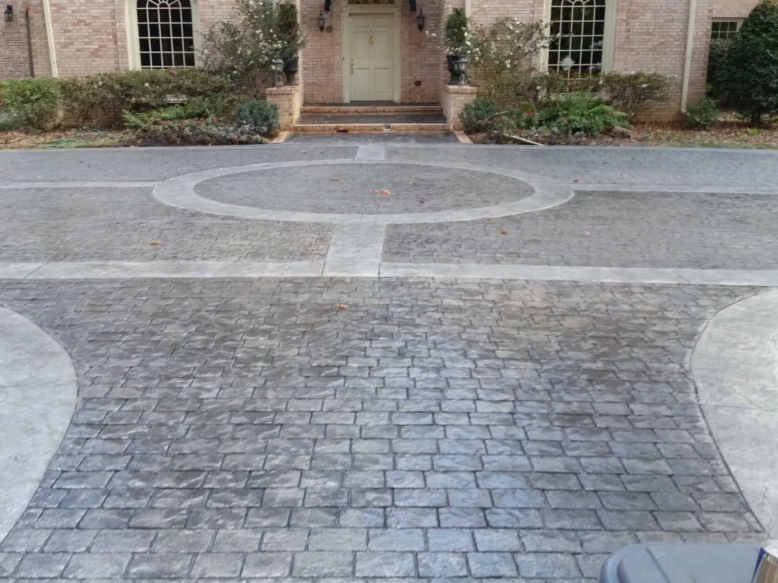 a paved area with a building in the background