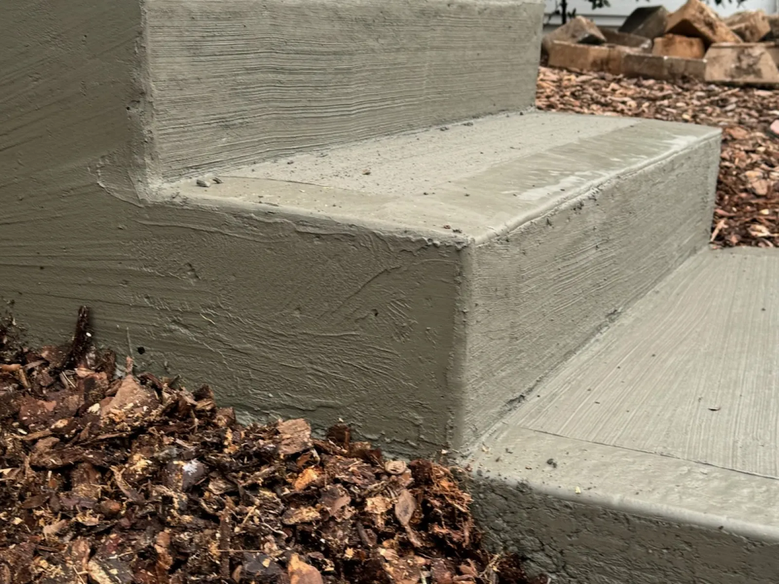 a concrete bench in a park