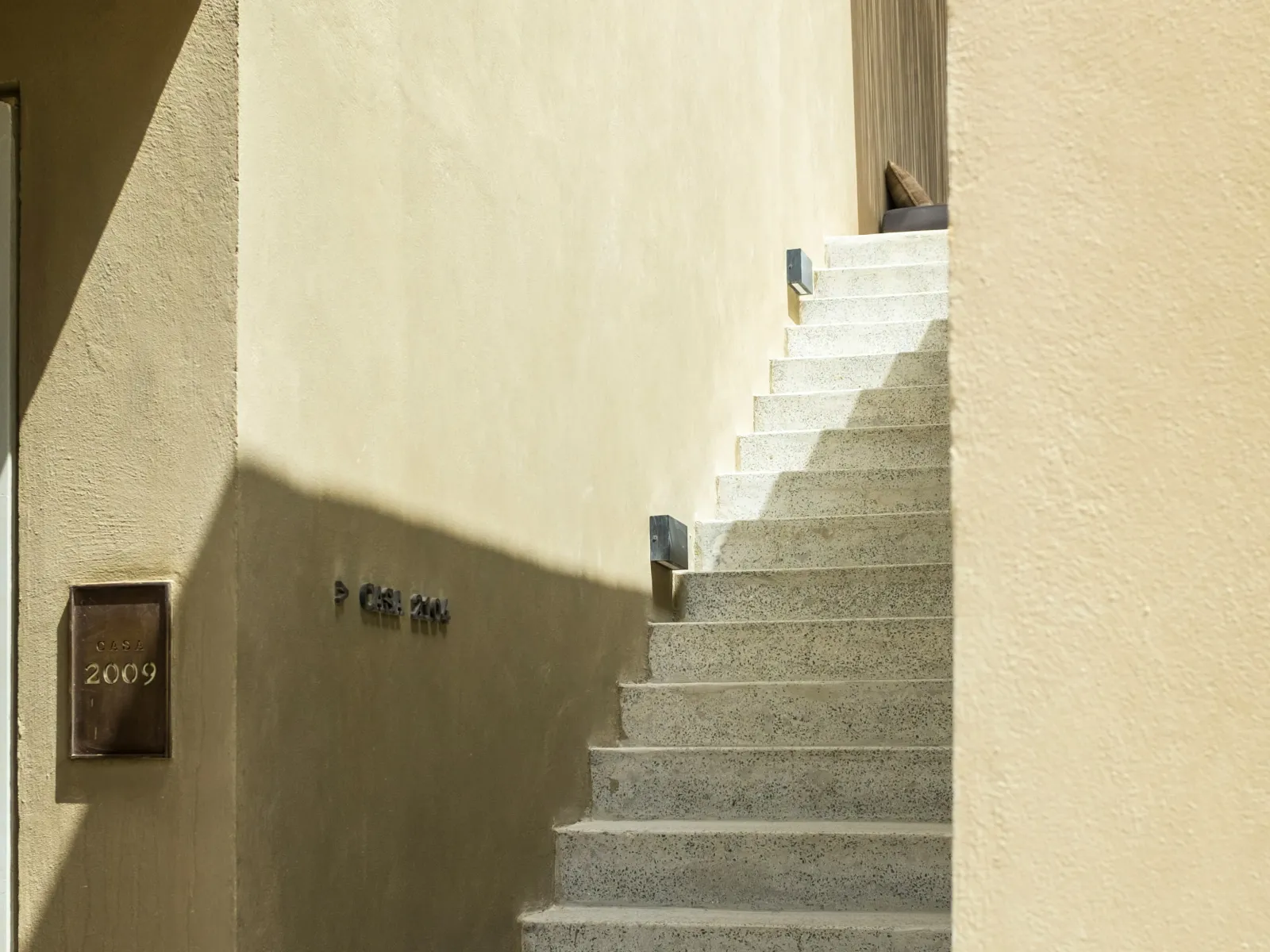 Textured gray stamped concrete floor tiles with a natural stone appearance.