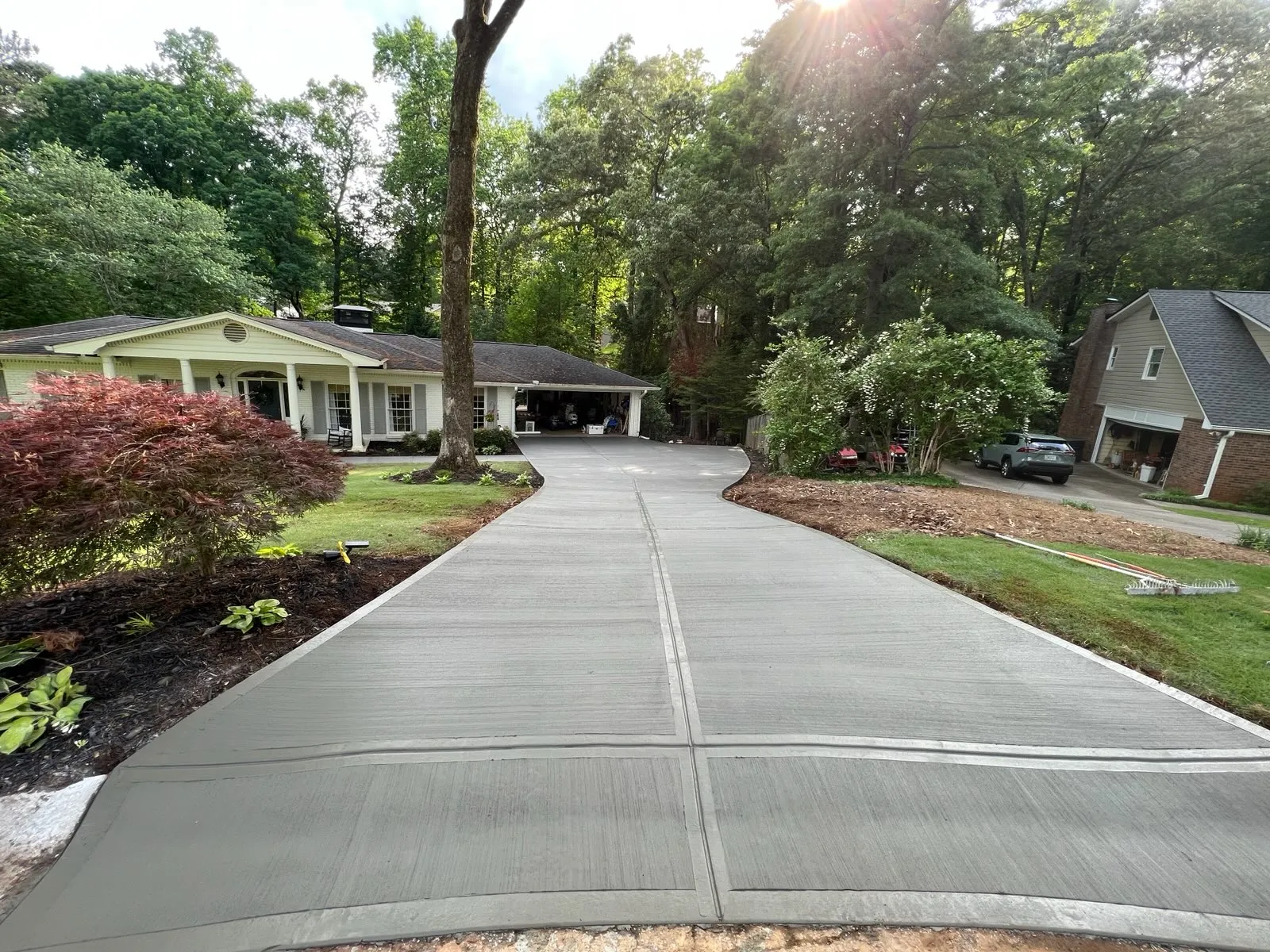 Driveway replacement integrates with surrounding landscape