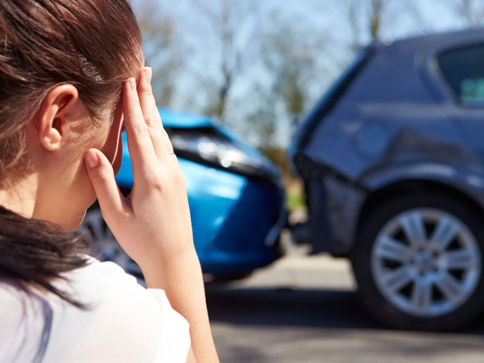 a woman in a car talking on a cell phone