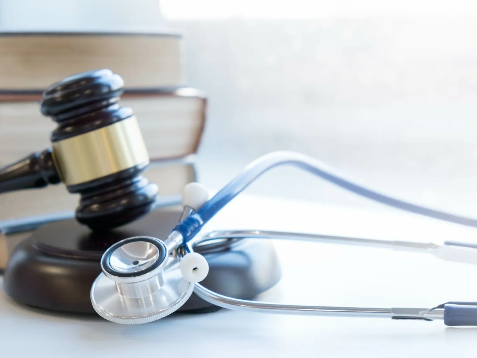 a stethoscope next to a gavel