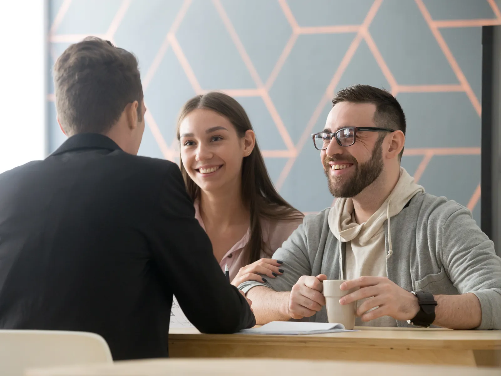 a young couple talking to a lawyer