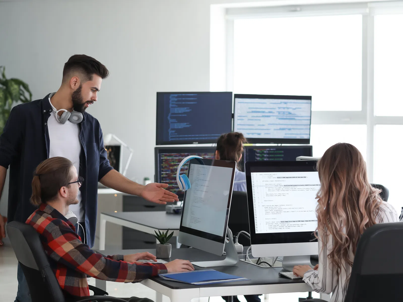 a man showing a woman something on the computer