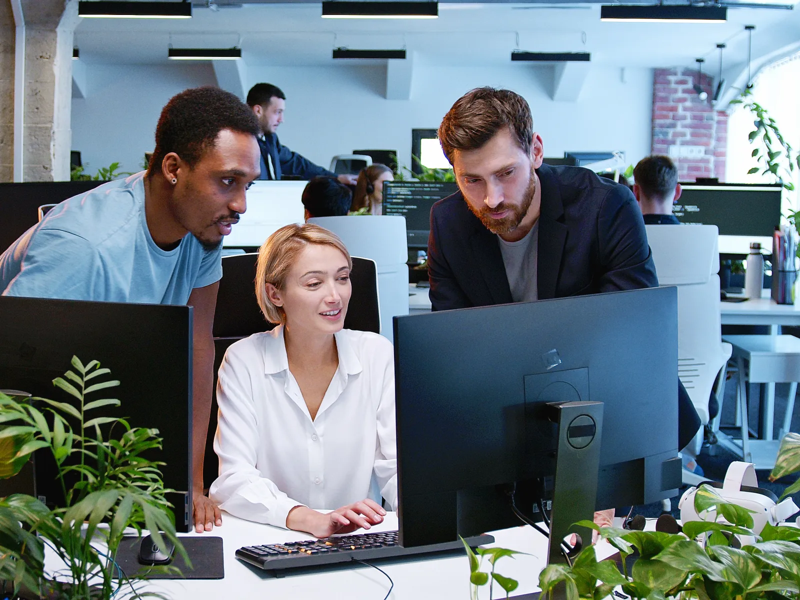 a group of people working in an office