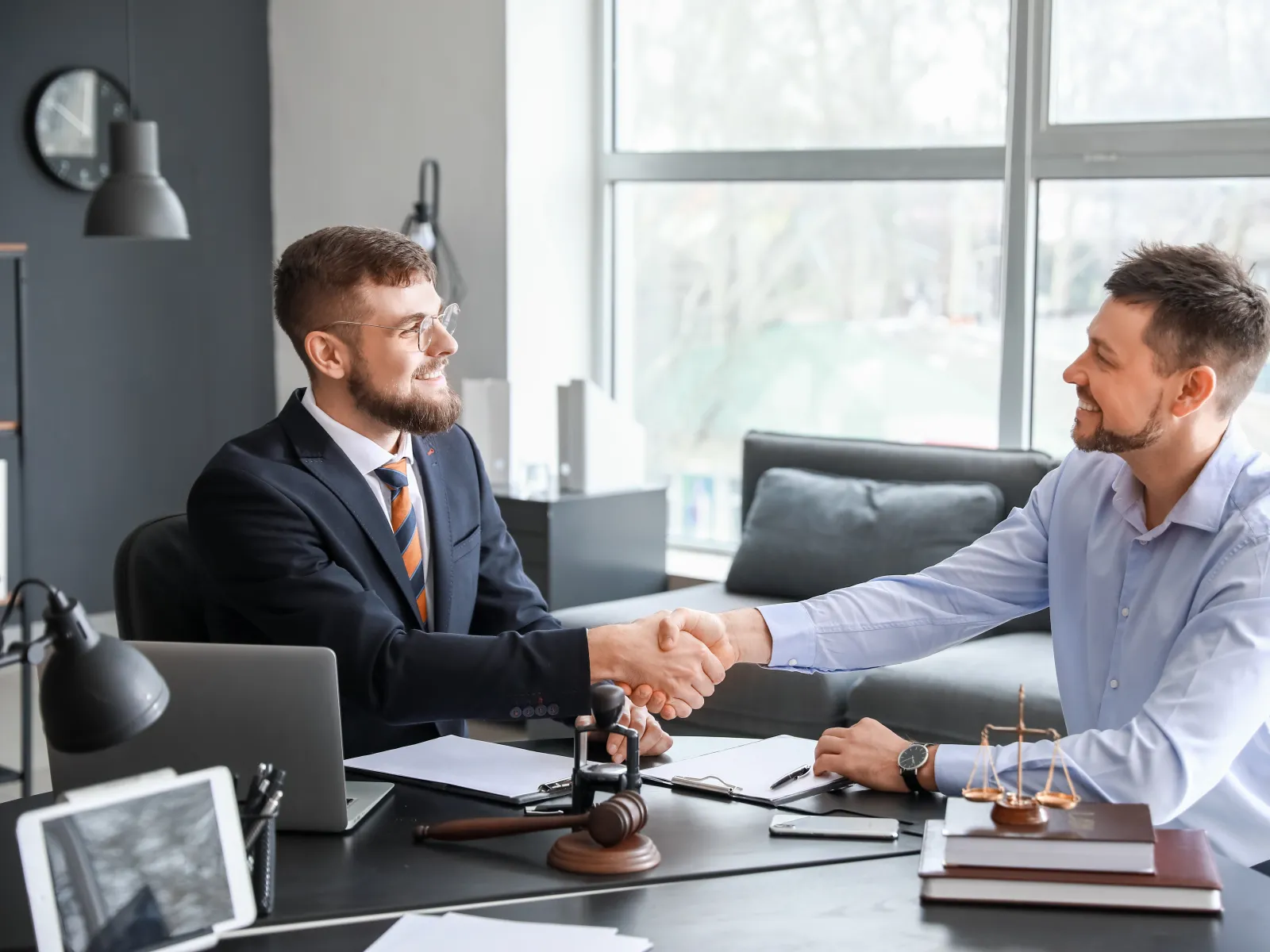 men sitting at a table talking