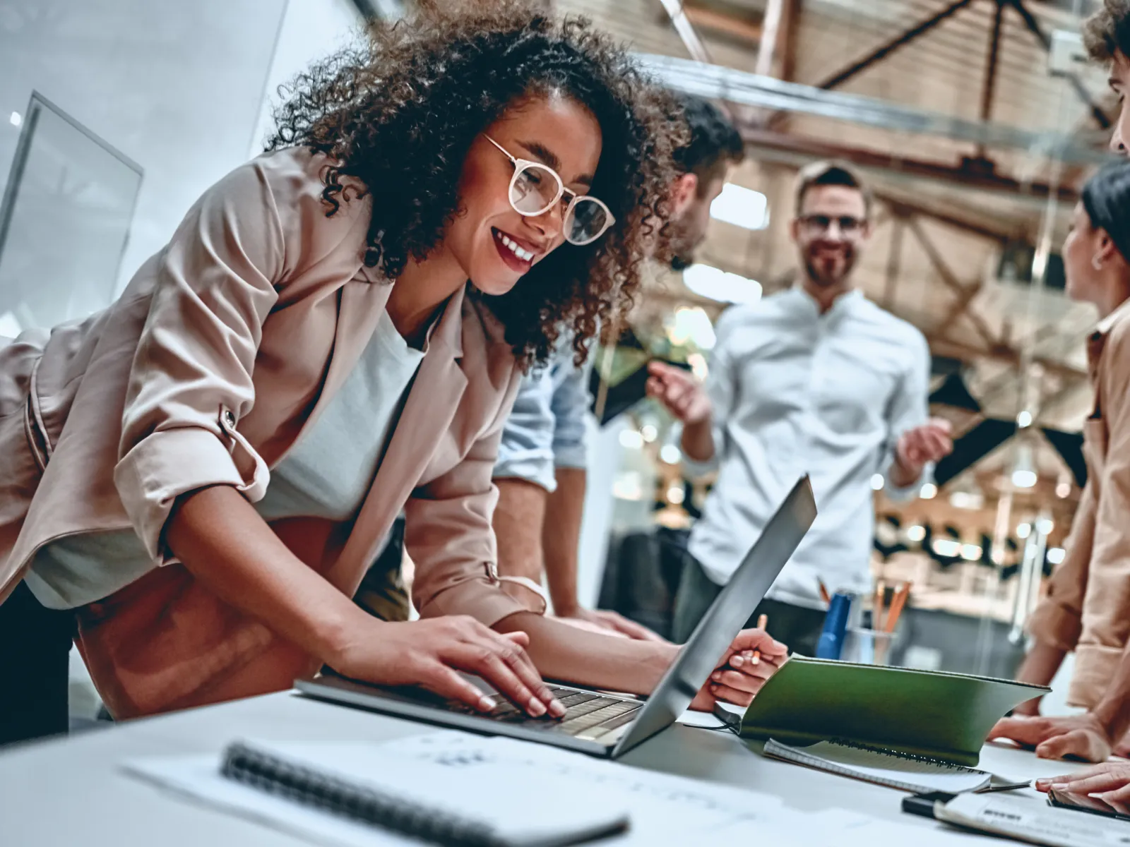 a group of people working on a computer