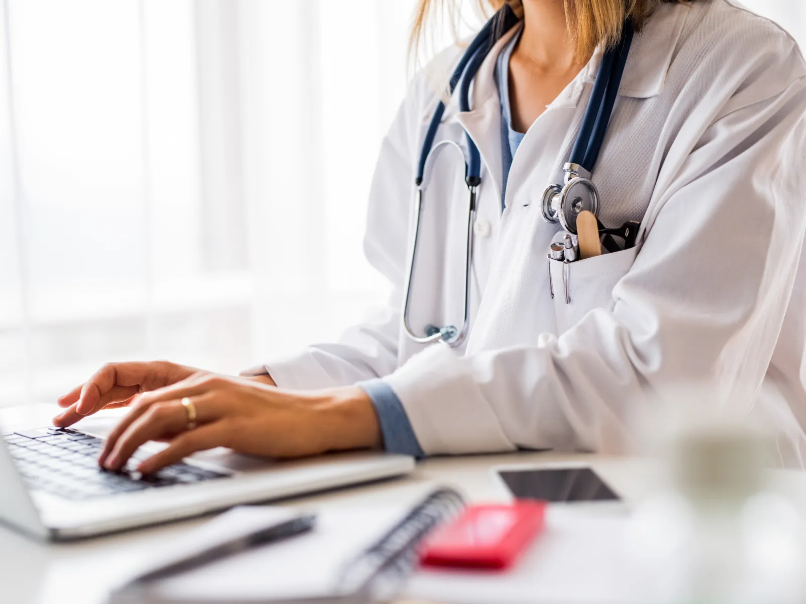 a doctor using a laptop