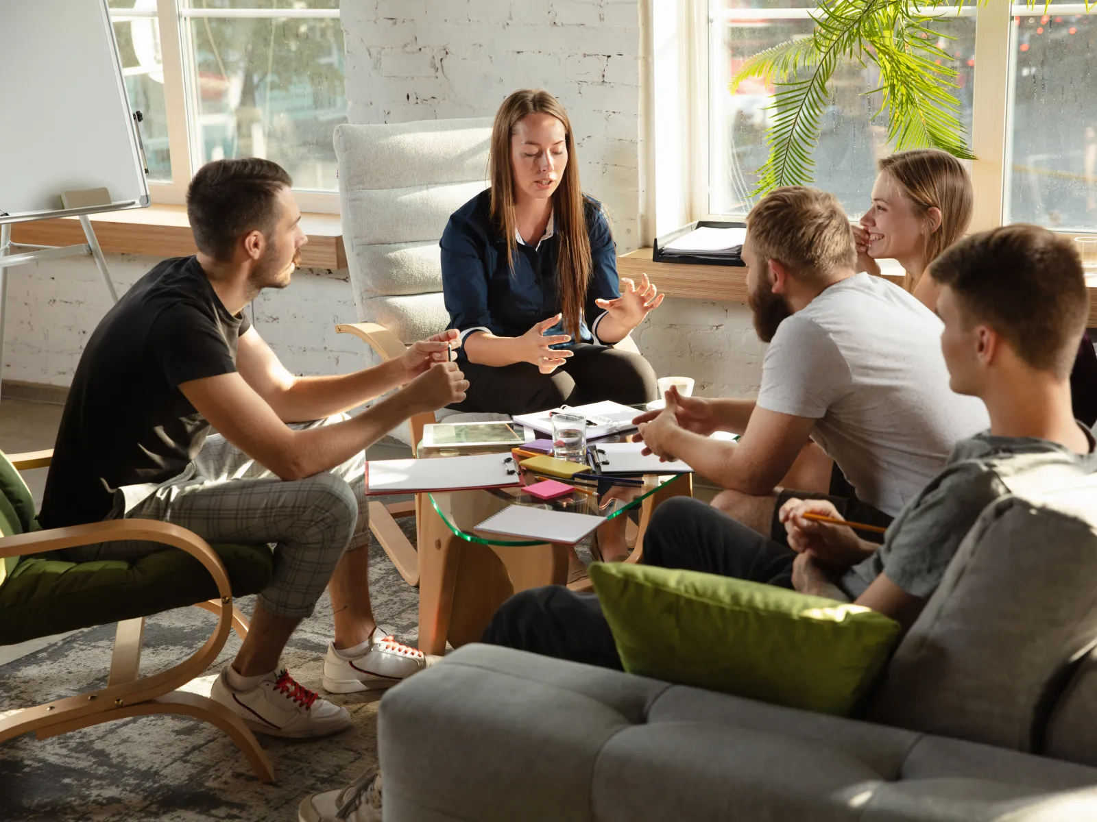 a group of people sitting around a table