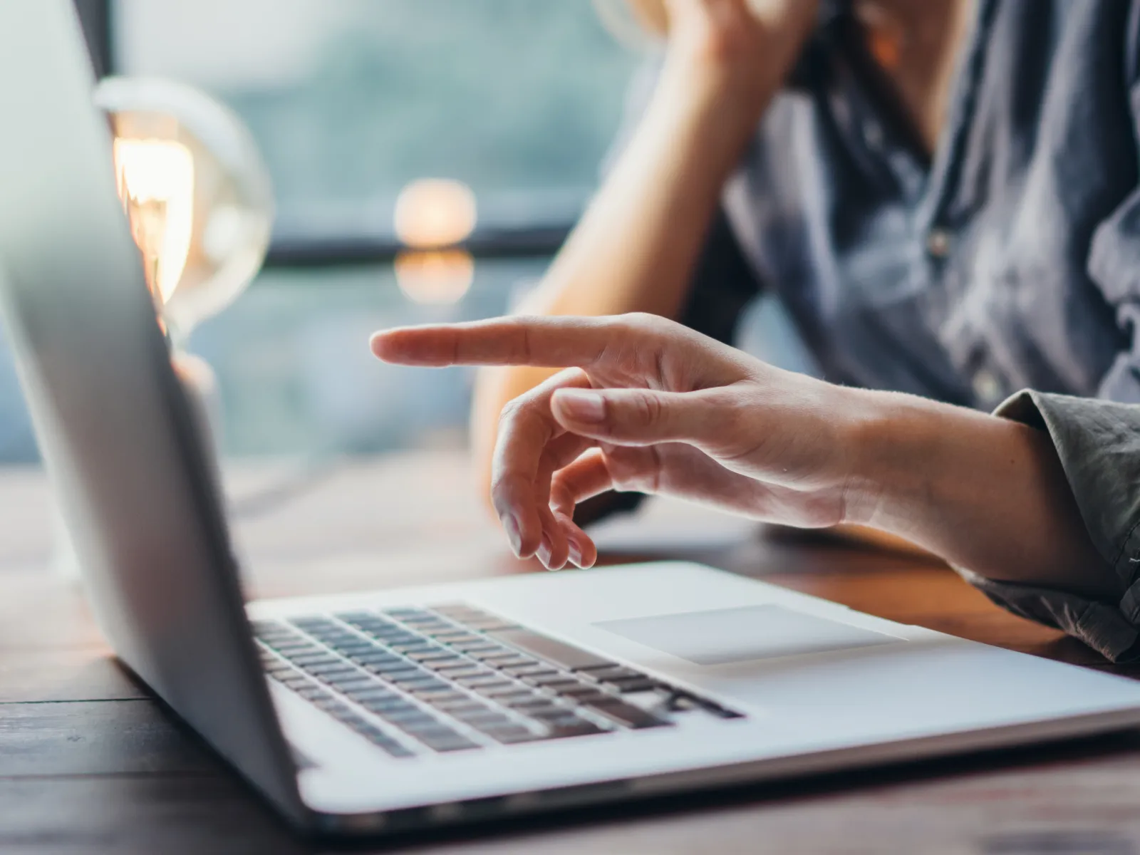 a man and a woman working on a laptop