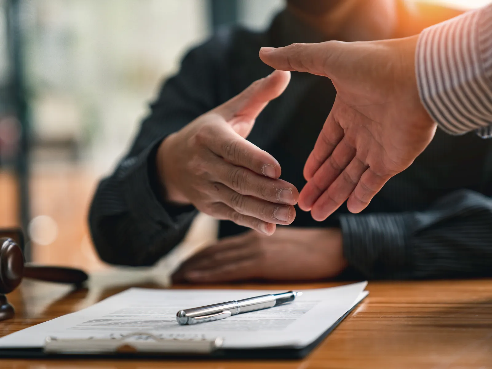 a close-up of people shaking hands