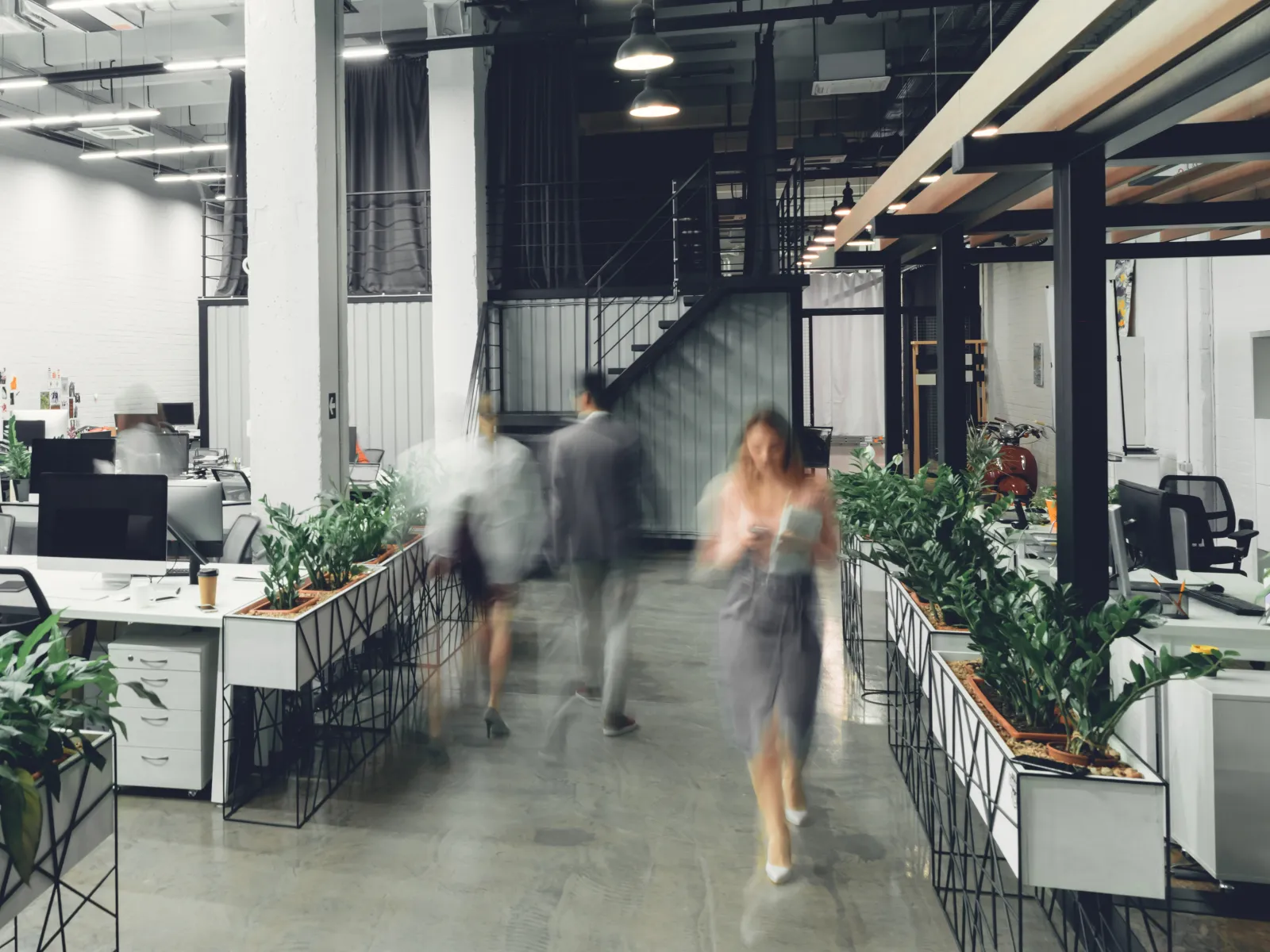 a group of people walking in a building