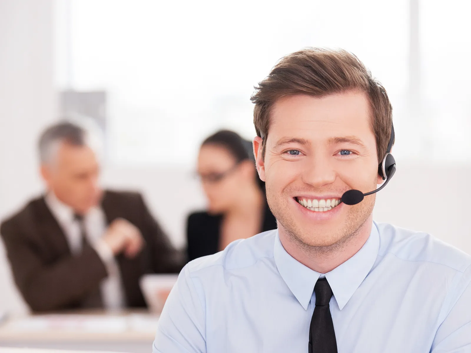 a man wearing a headset and a tie