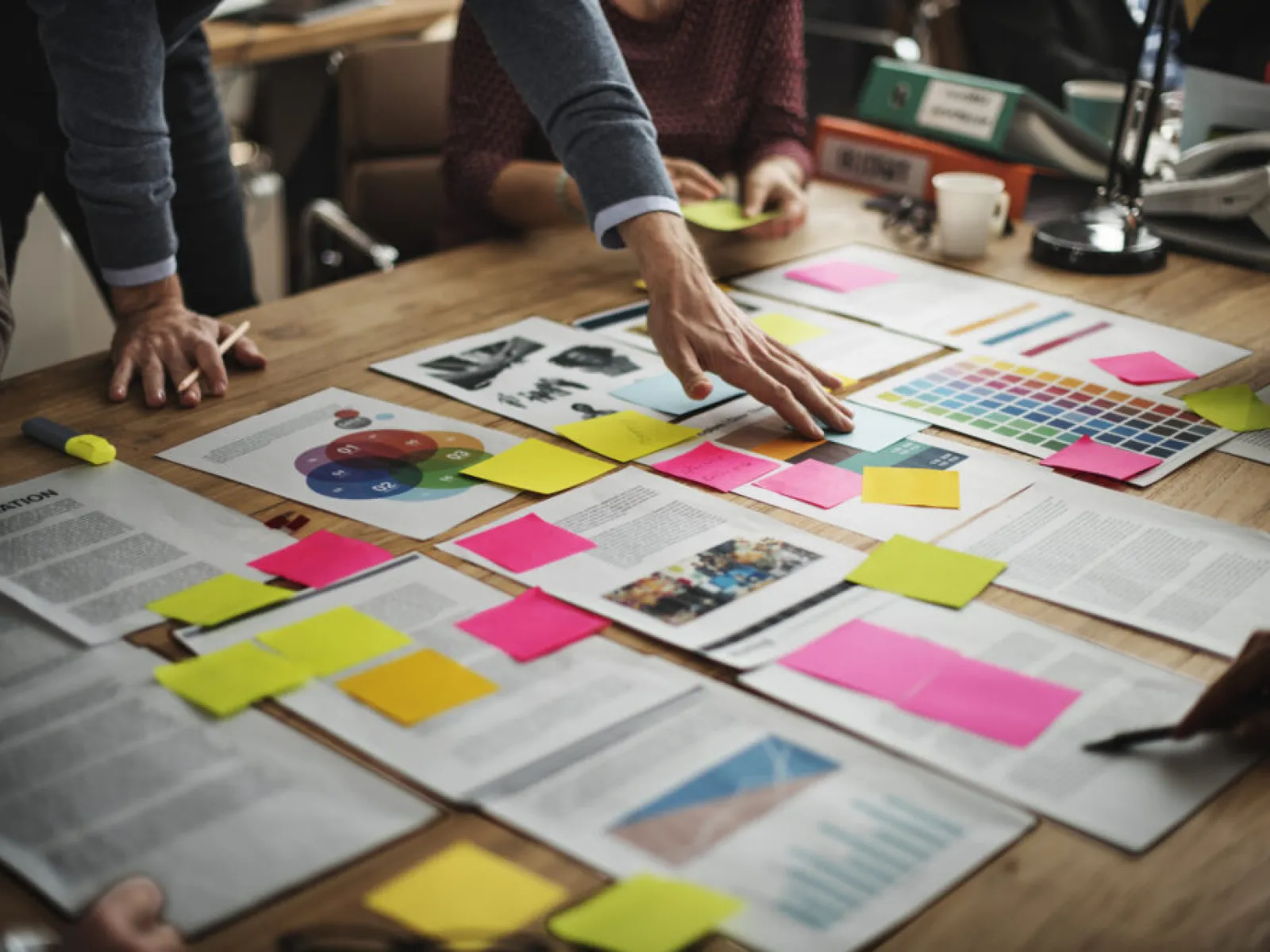 a table with colorful paper on it