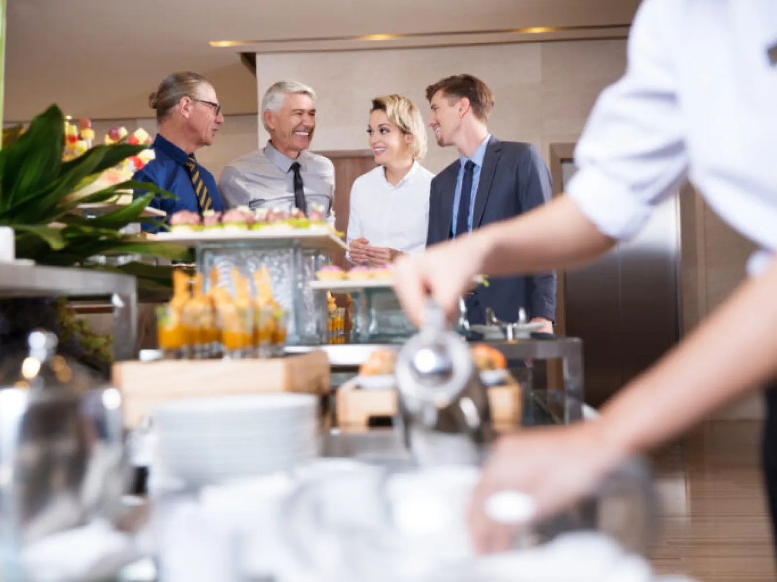 a group of people in a kitchen