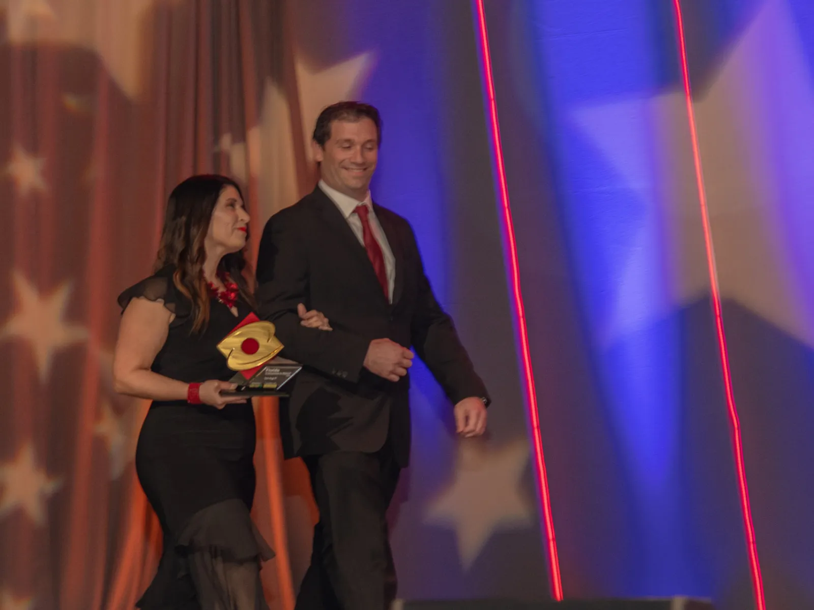 a man and woman on a stage