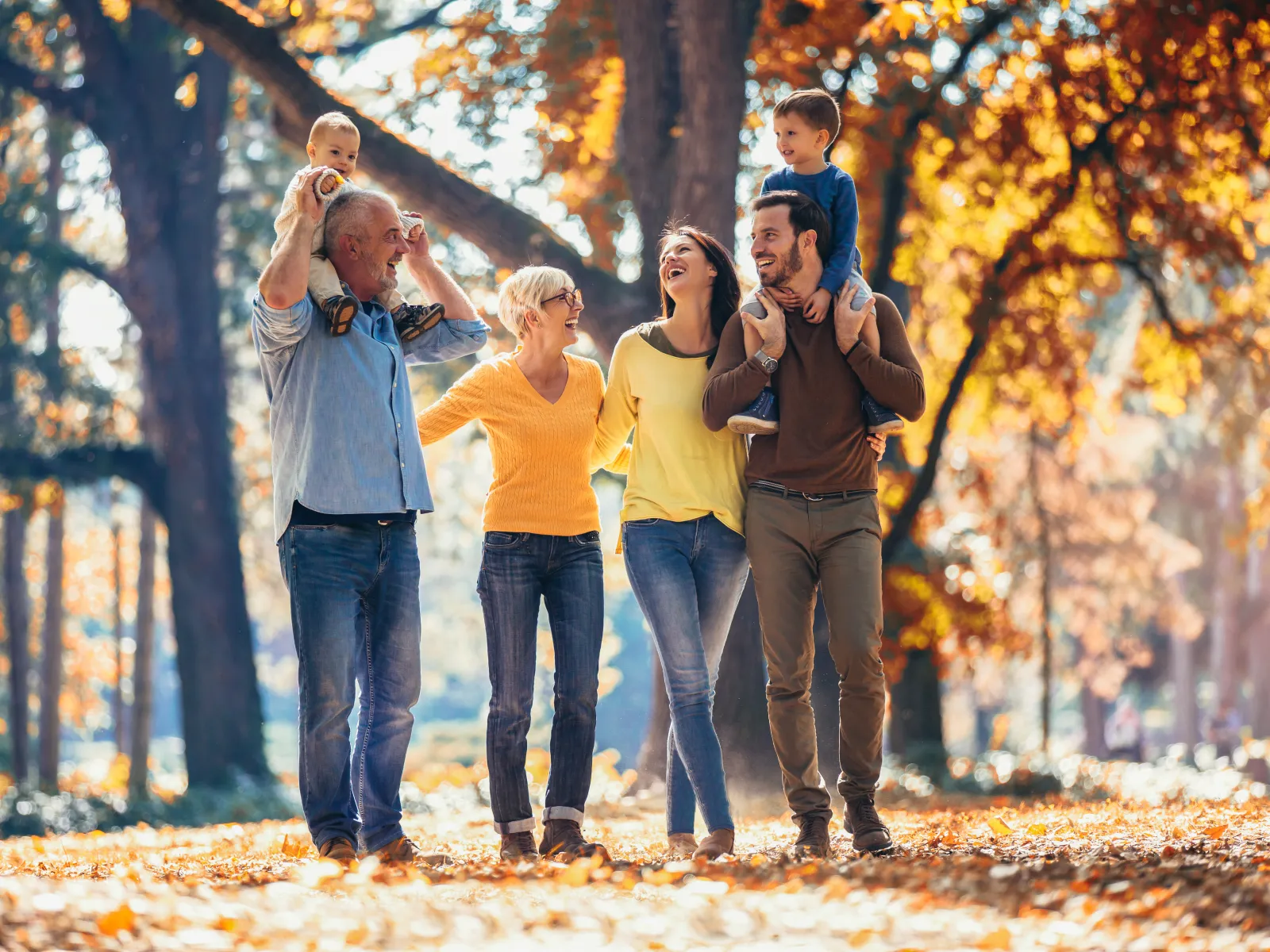 a group of people standing in a forest