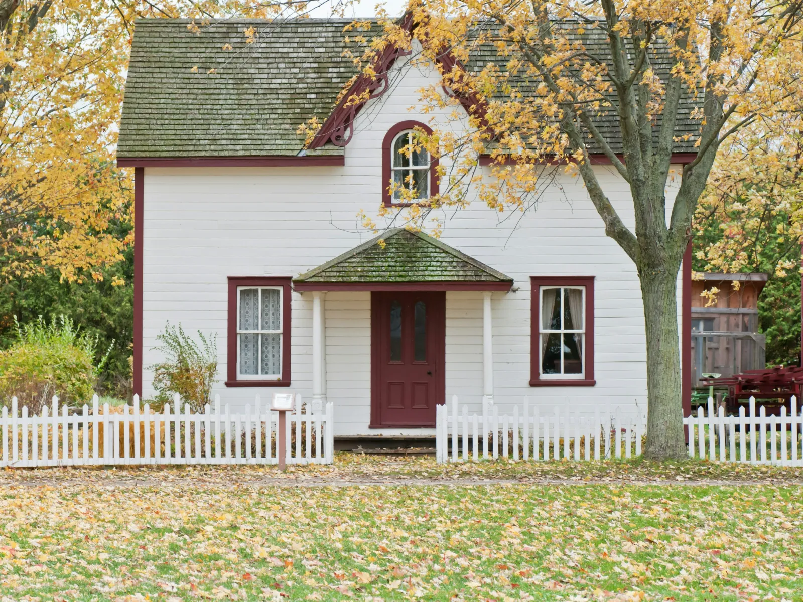 a white house with a red door