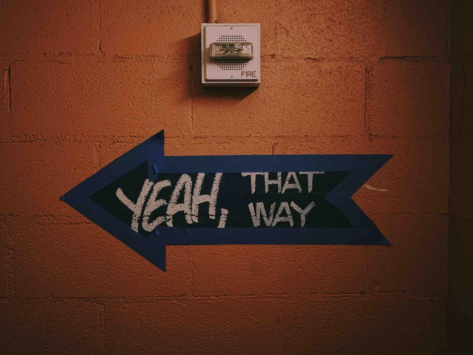 a sign on a brick wall