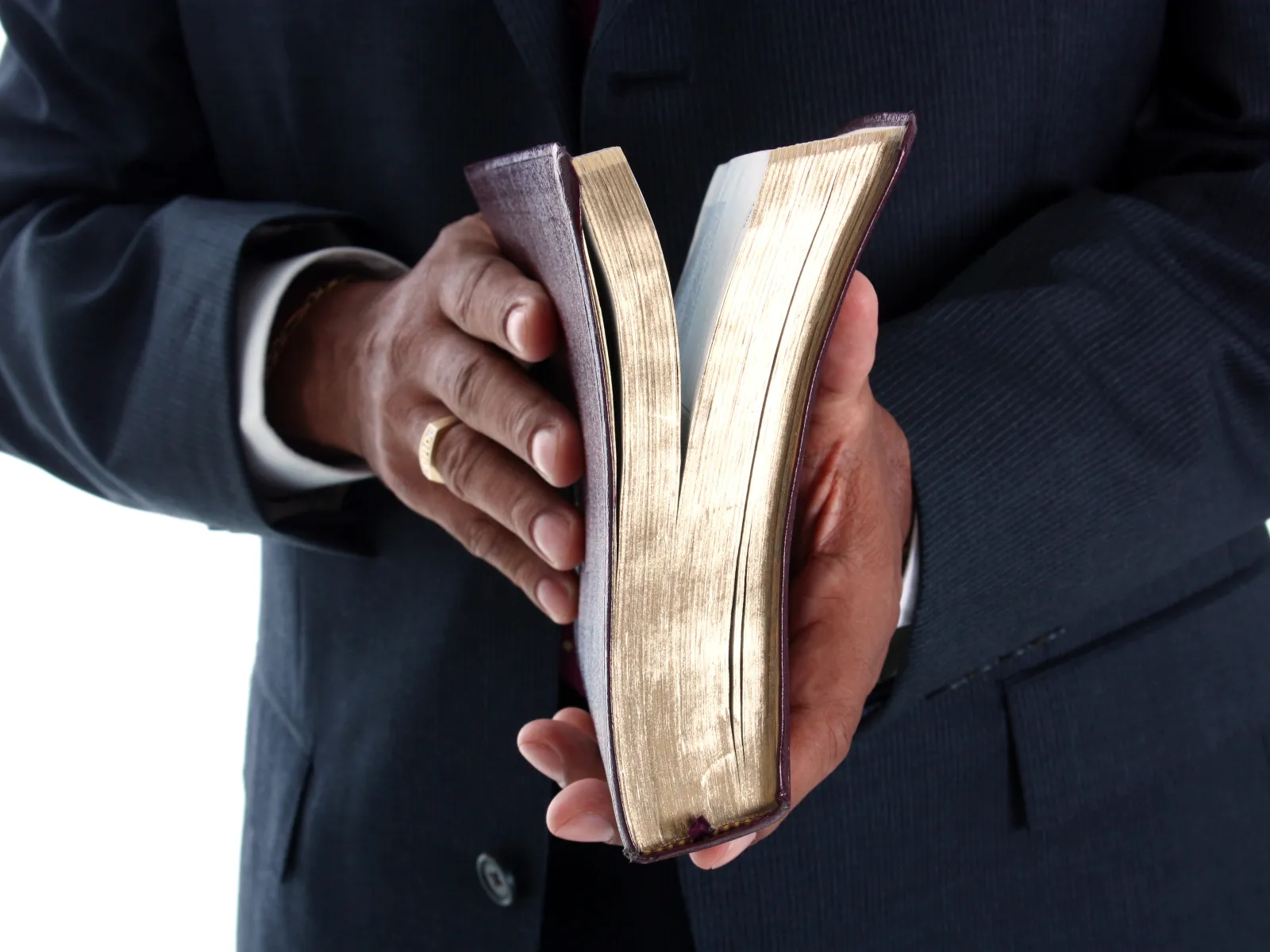 a person holding a stack of papers