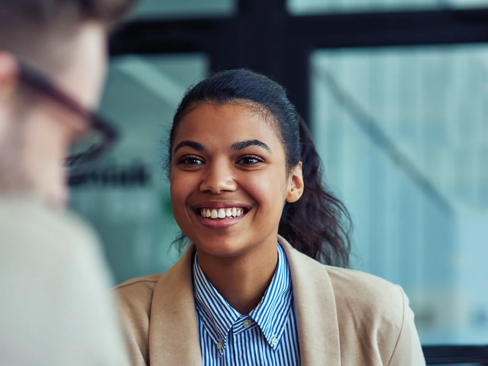 a woman smiling at a man