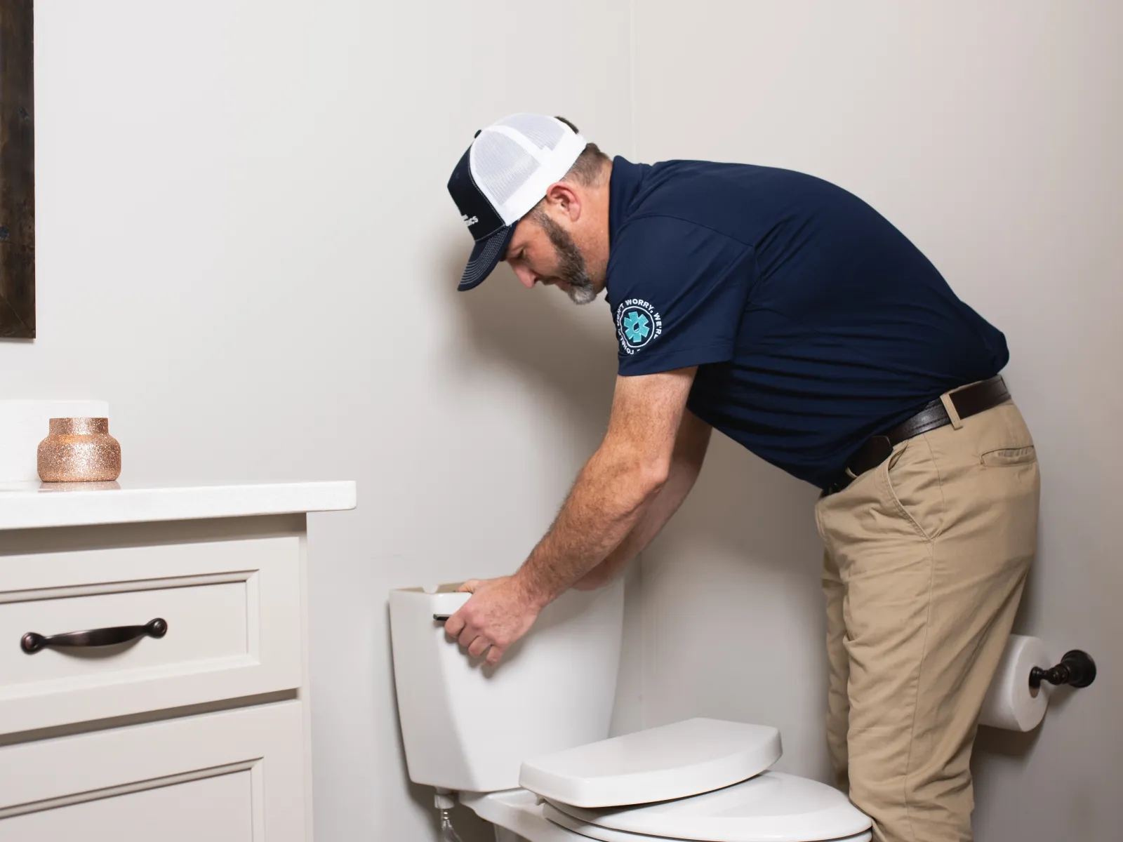 Plumbing Paramedics technician fixing a toilet in Crown Point, Indiana