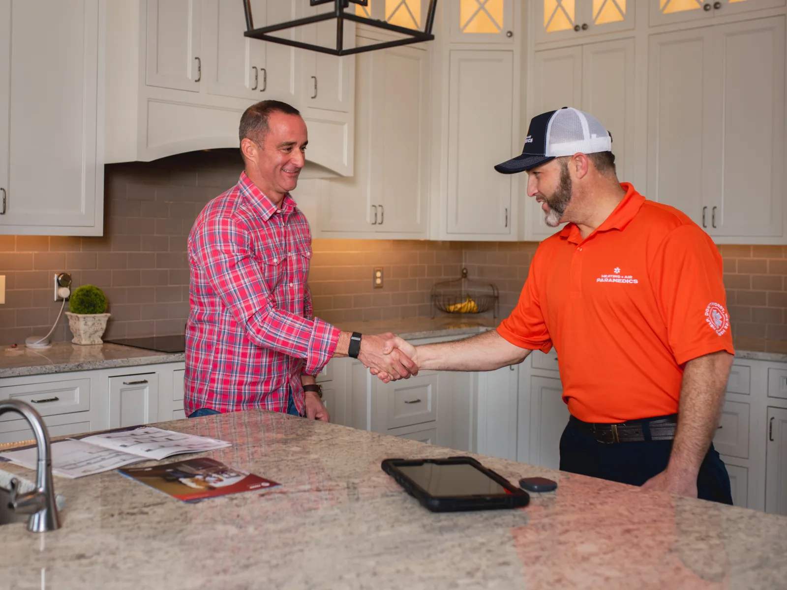 Heating Air paramedics worker shaking hands with homeowner