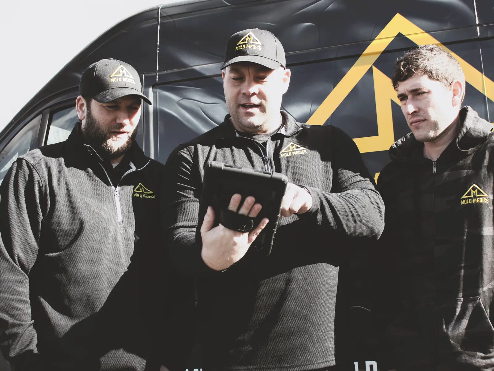 a group of men in black jackets