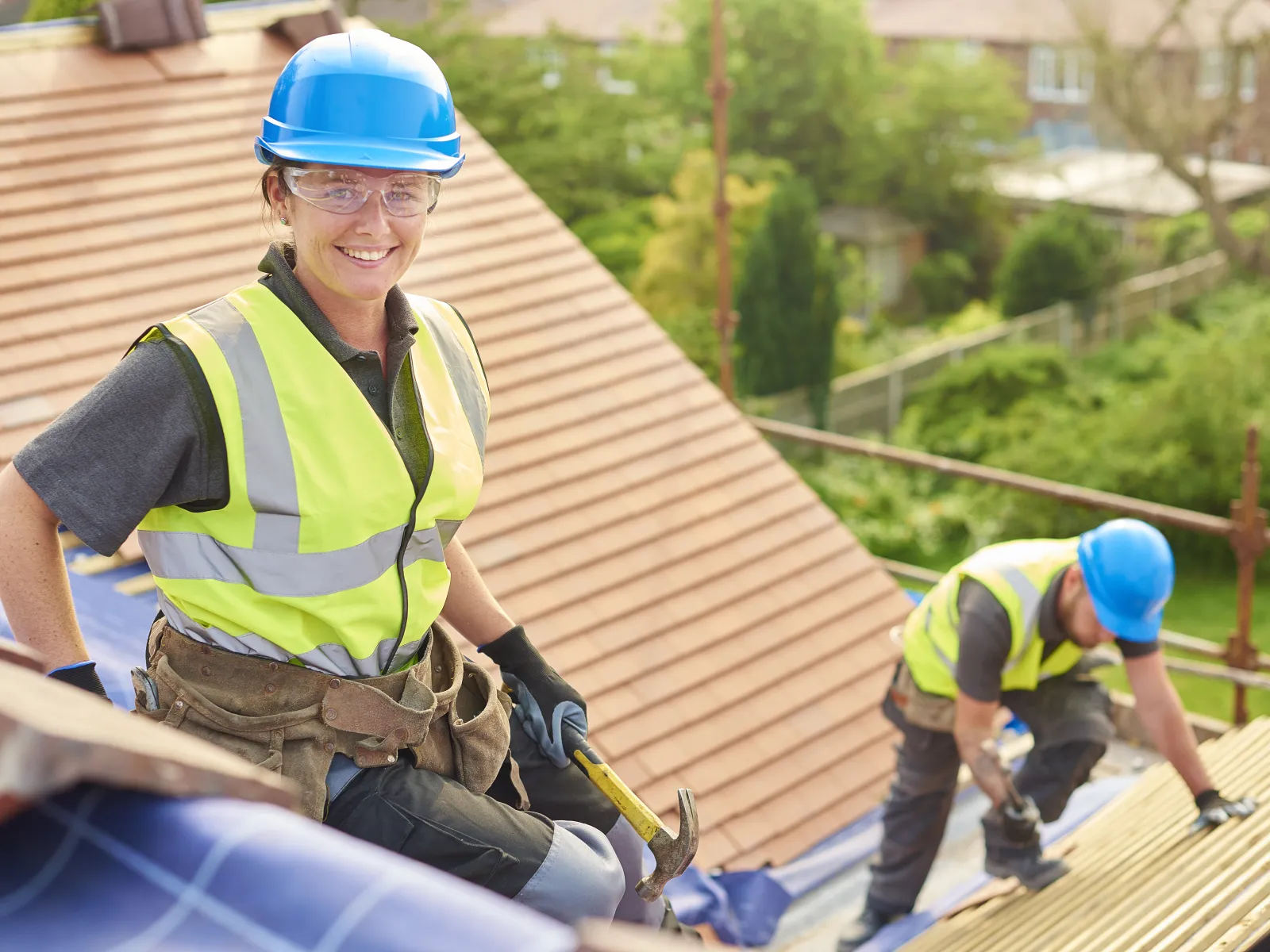 a few people wearing hardhats and working on a construction site