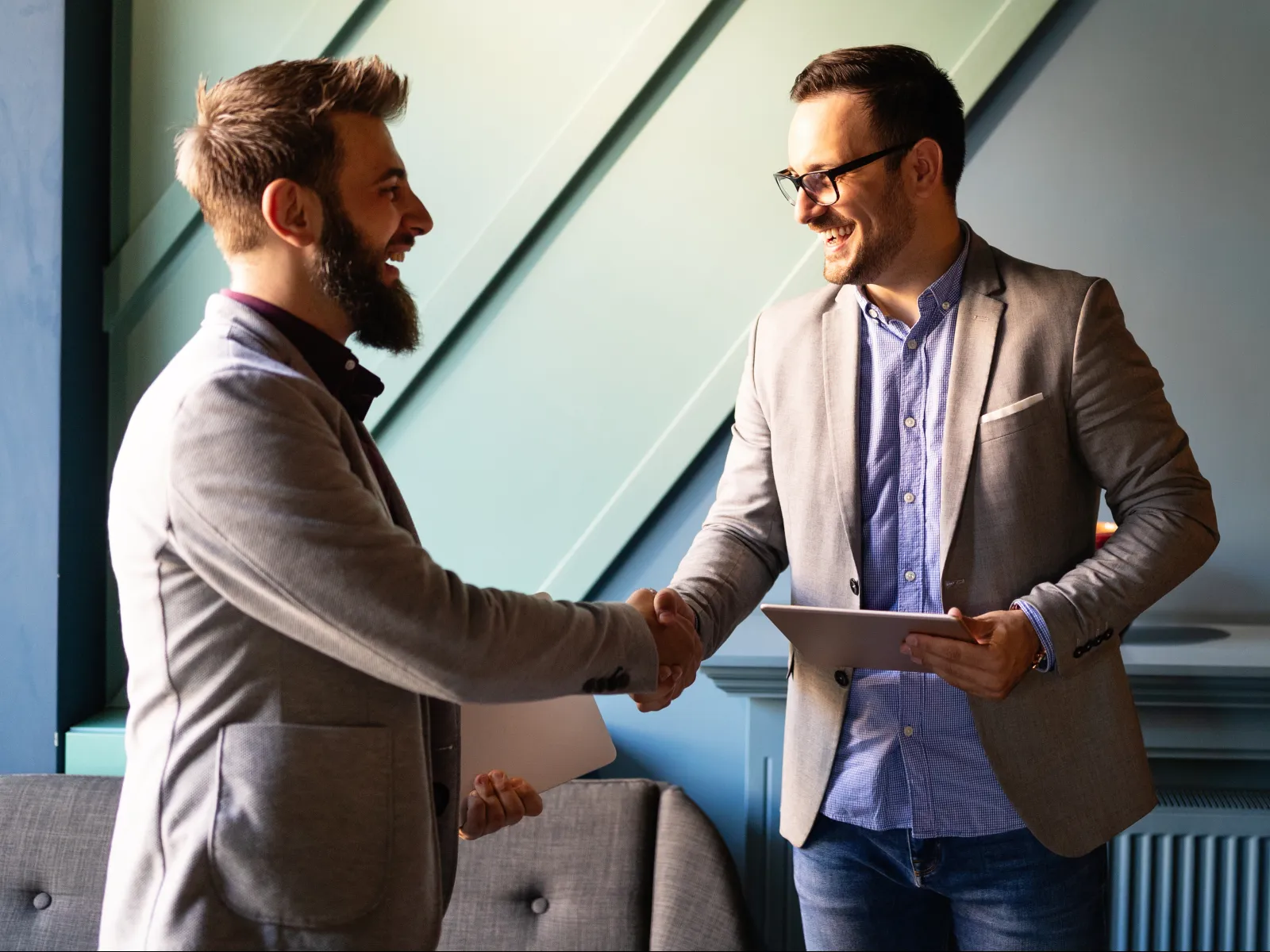a couple of men shaking hands