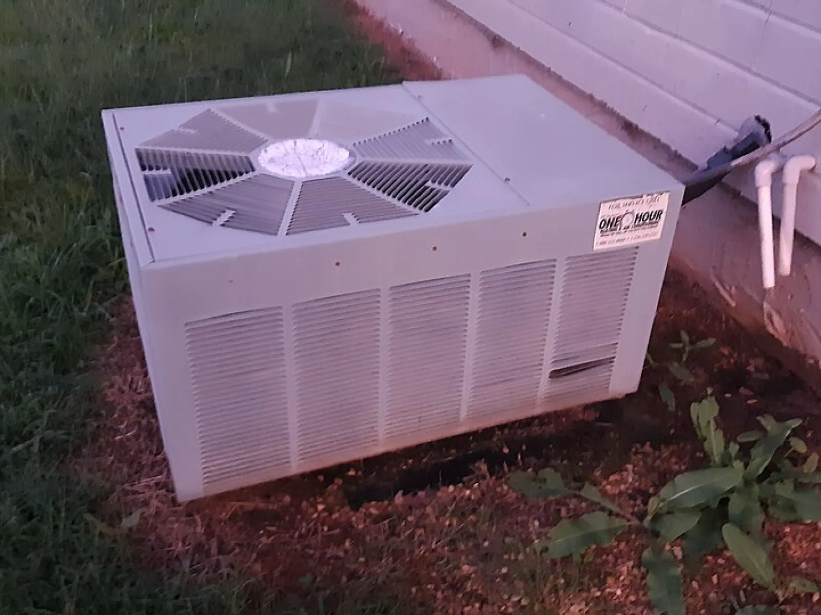 a rheem hvac unit pictured outside a home