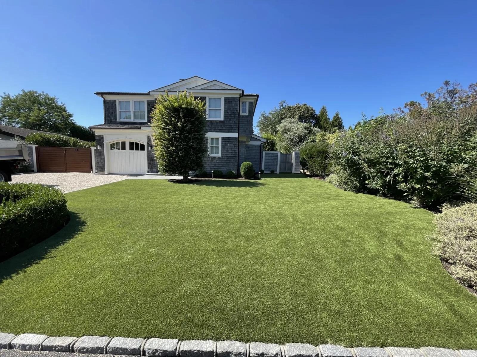 a house with a synthetic lawn