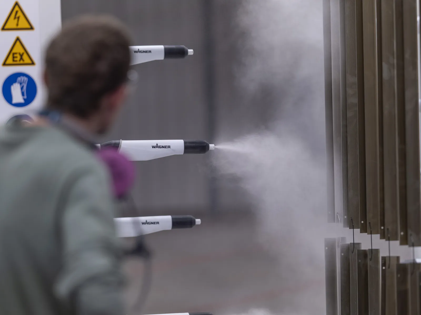 a man spraying water on a door