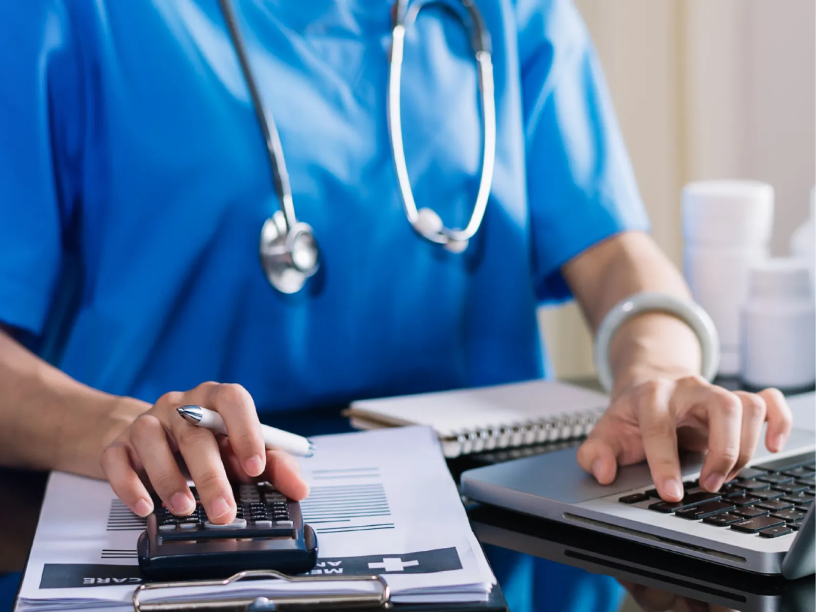 a doctor using a laptop