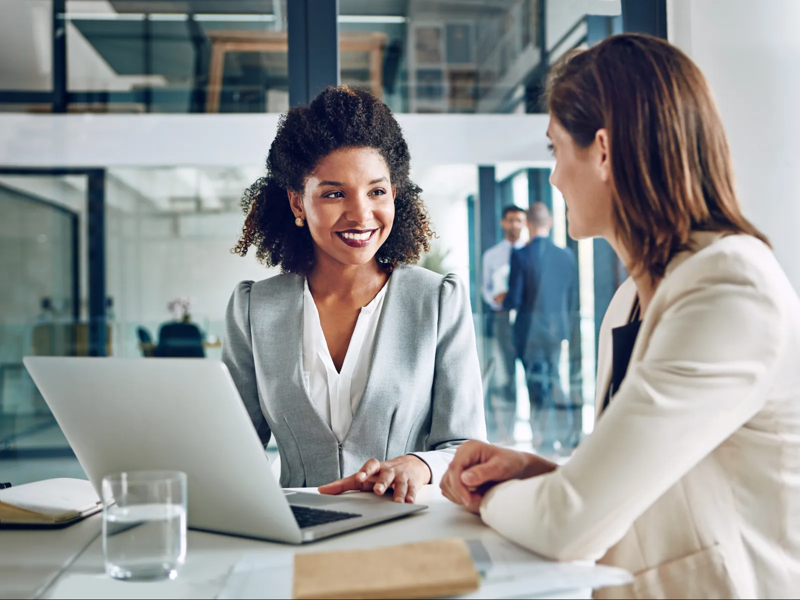 a person showing a person something on the laptop