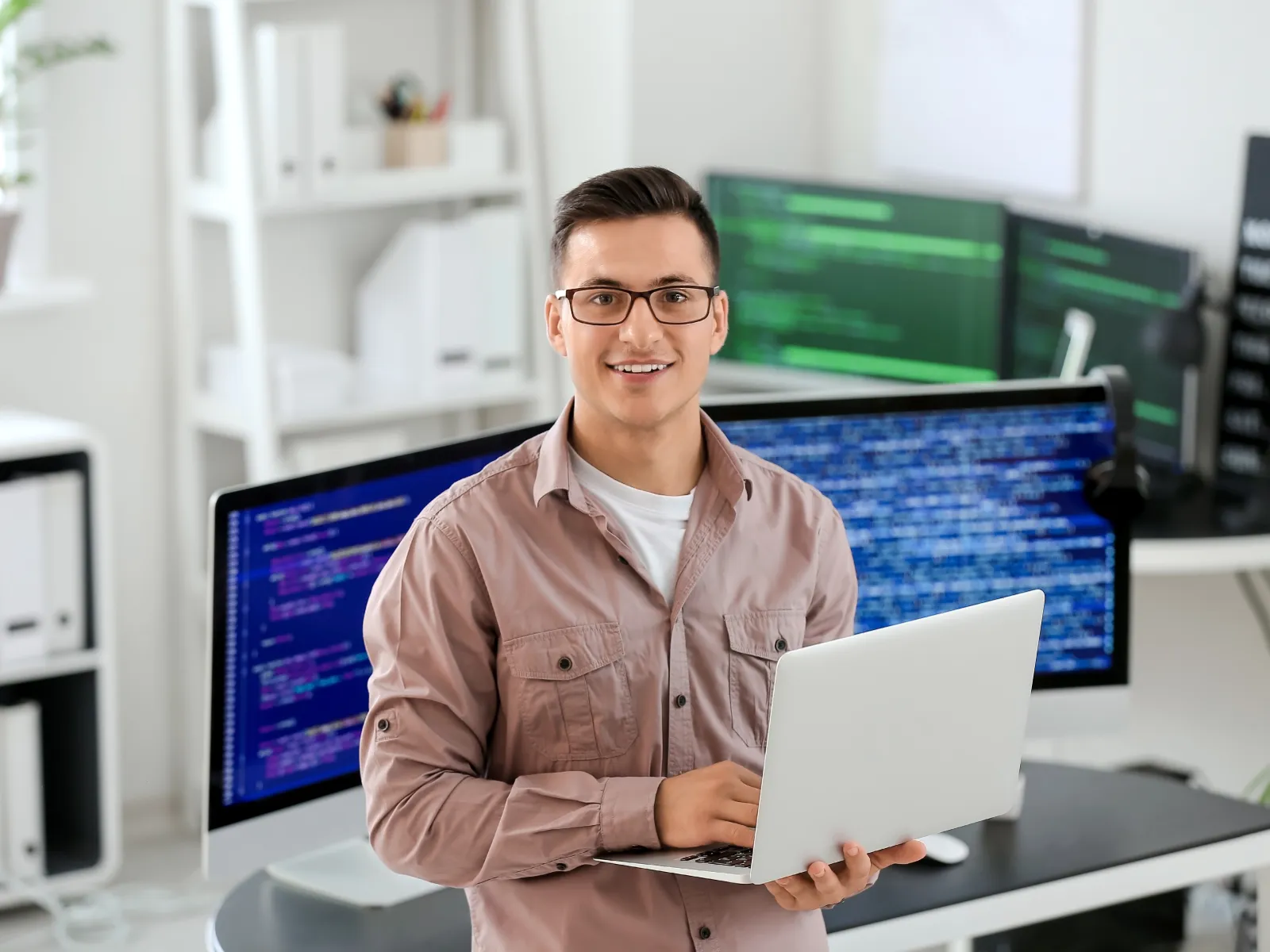 a person holding a laptop
