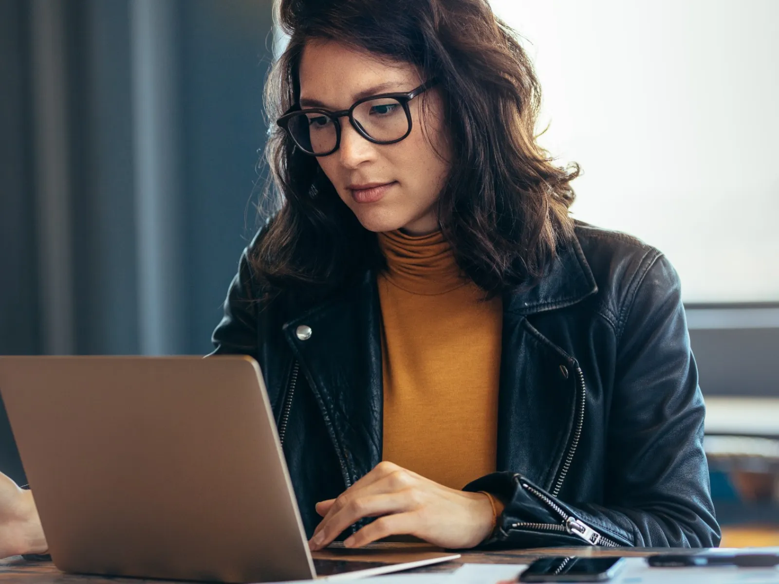 a woman working on her laptop