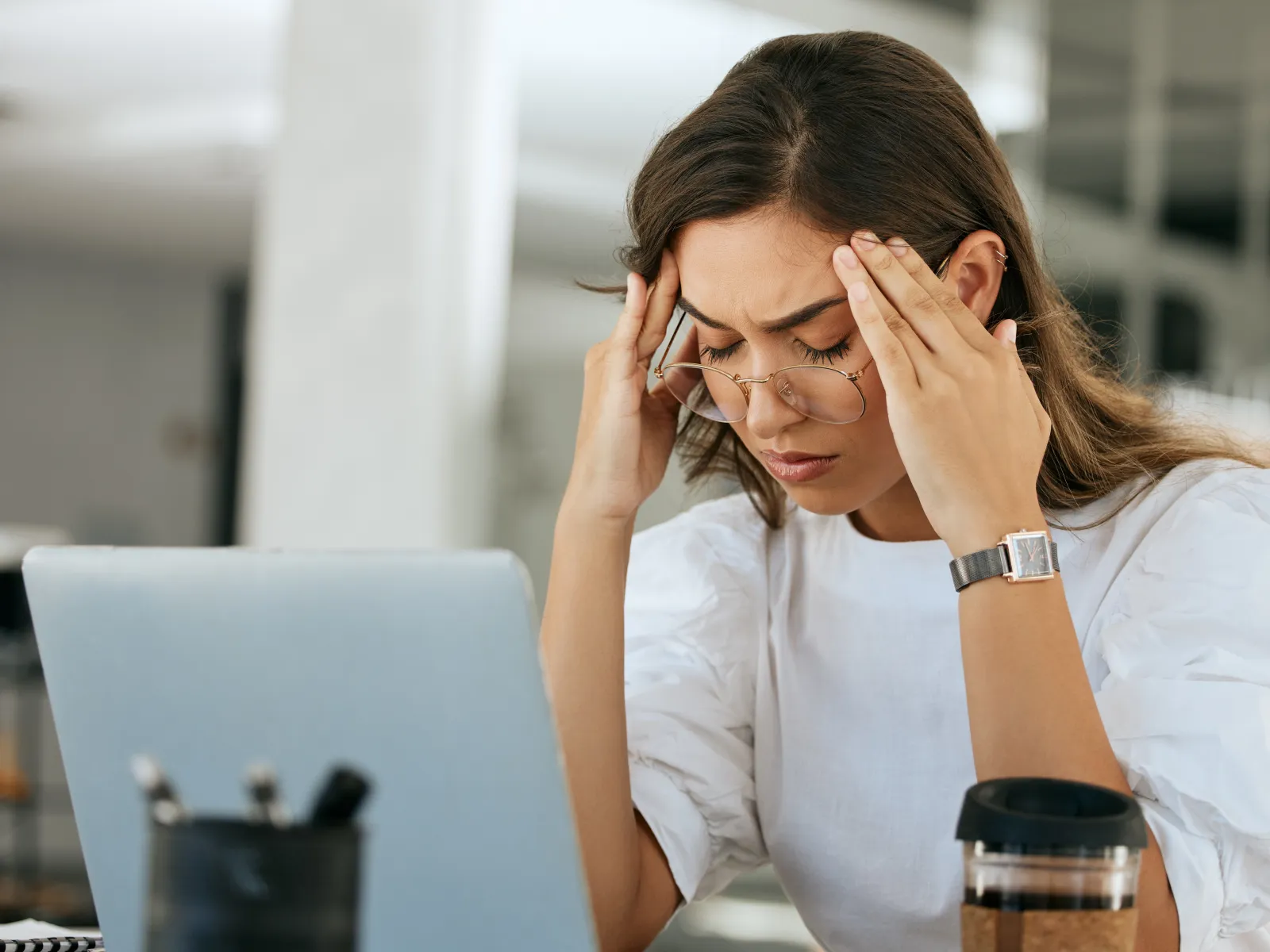 a woman with her hands on her face