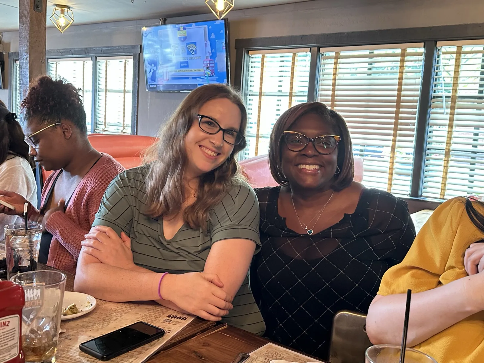 a group of people sitting at a table