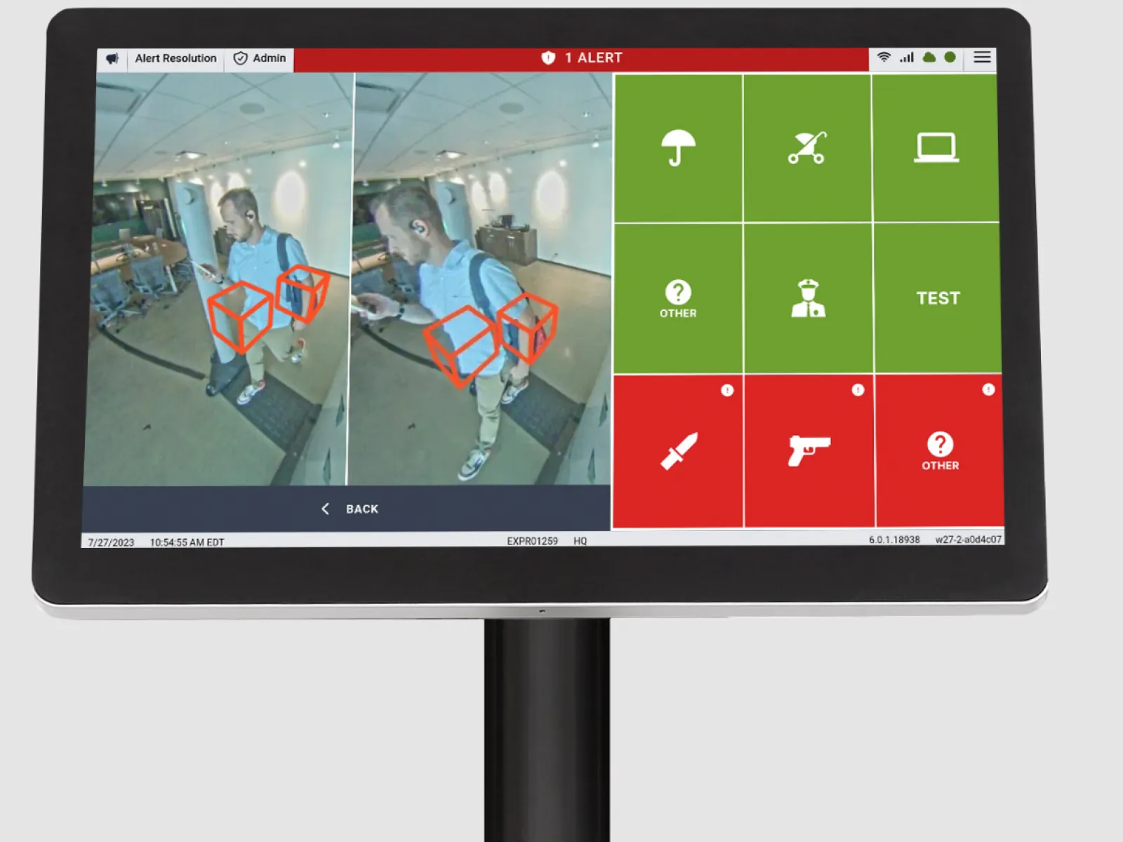 Security screen with online alert showing a man detected and tracked by surveillance software visualizing red 3D boxes