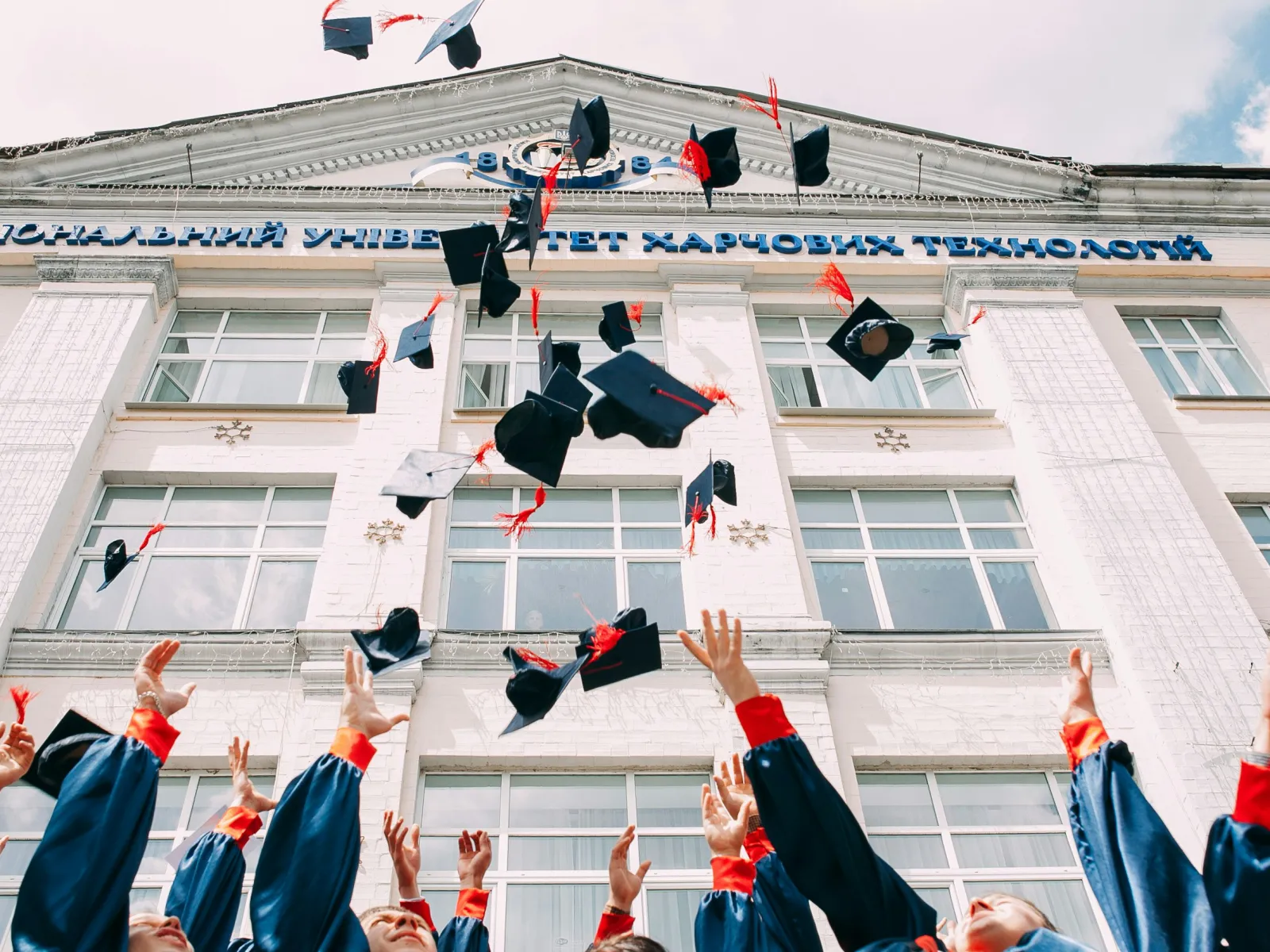 a group of people raising their hands