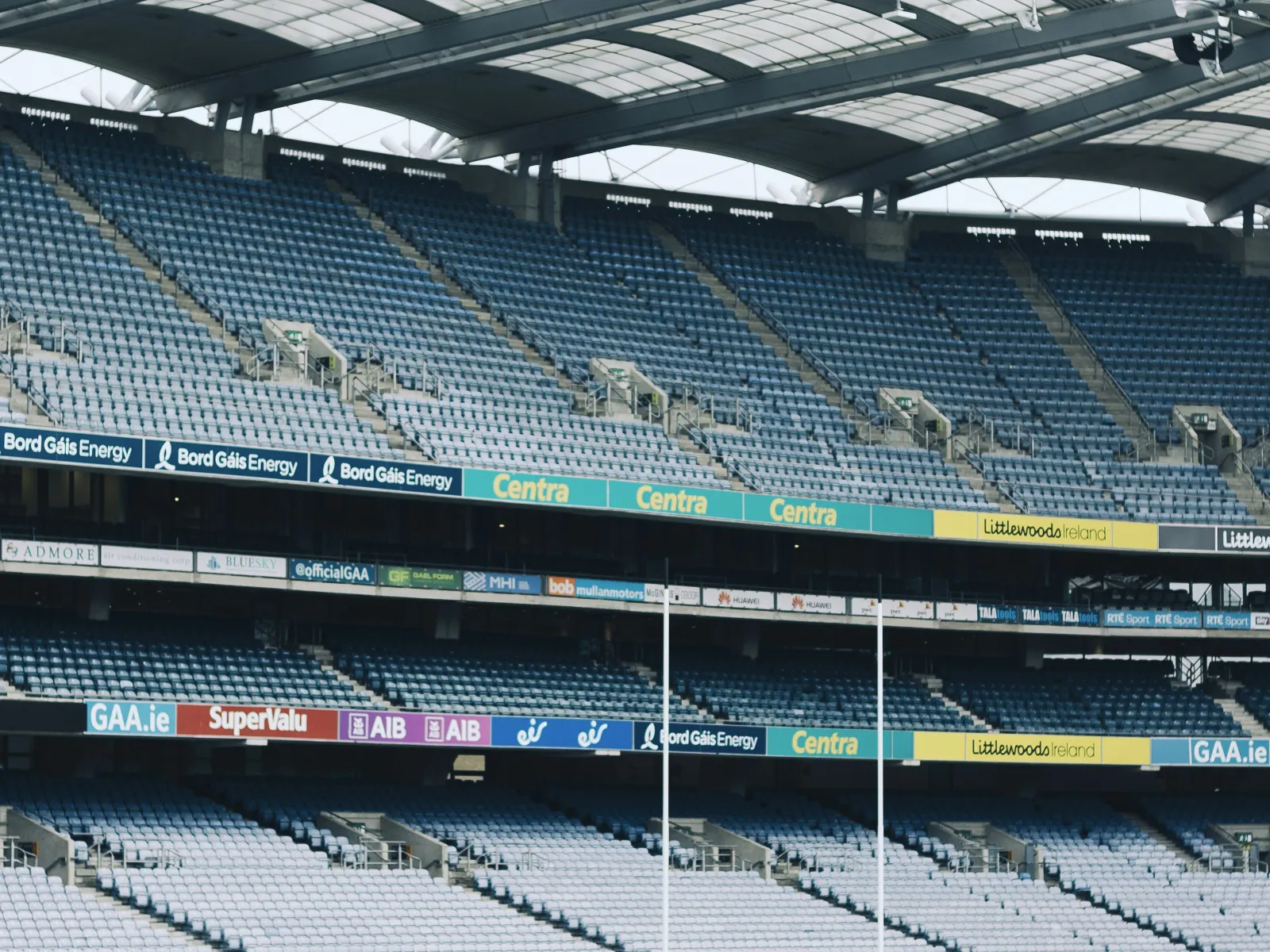 a sports stadium with a field and a large crowd