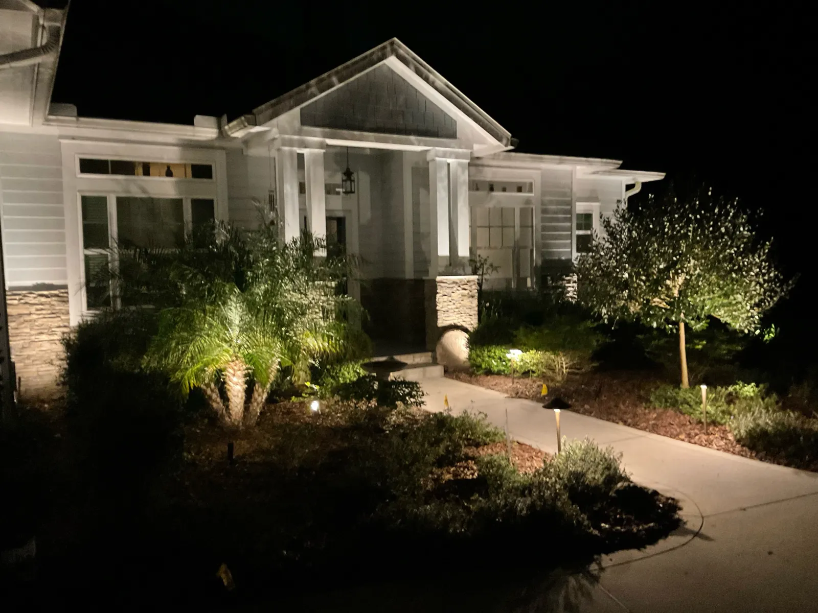a house with a large front yard with Graceland in the background