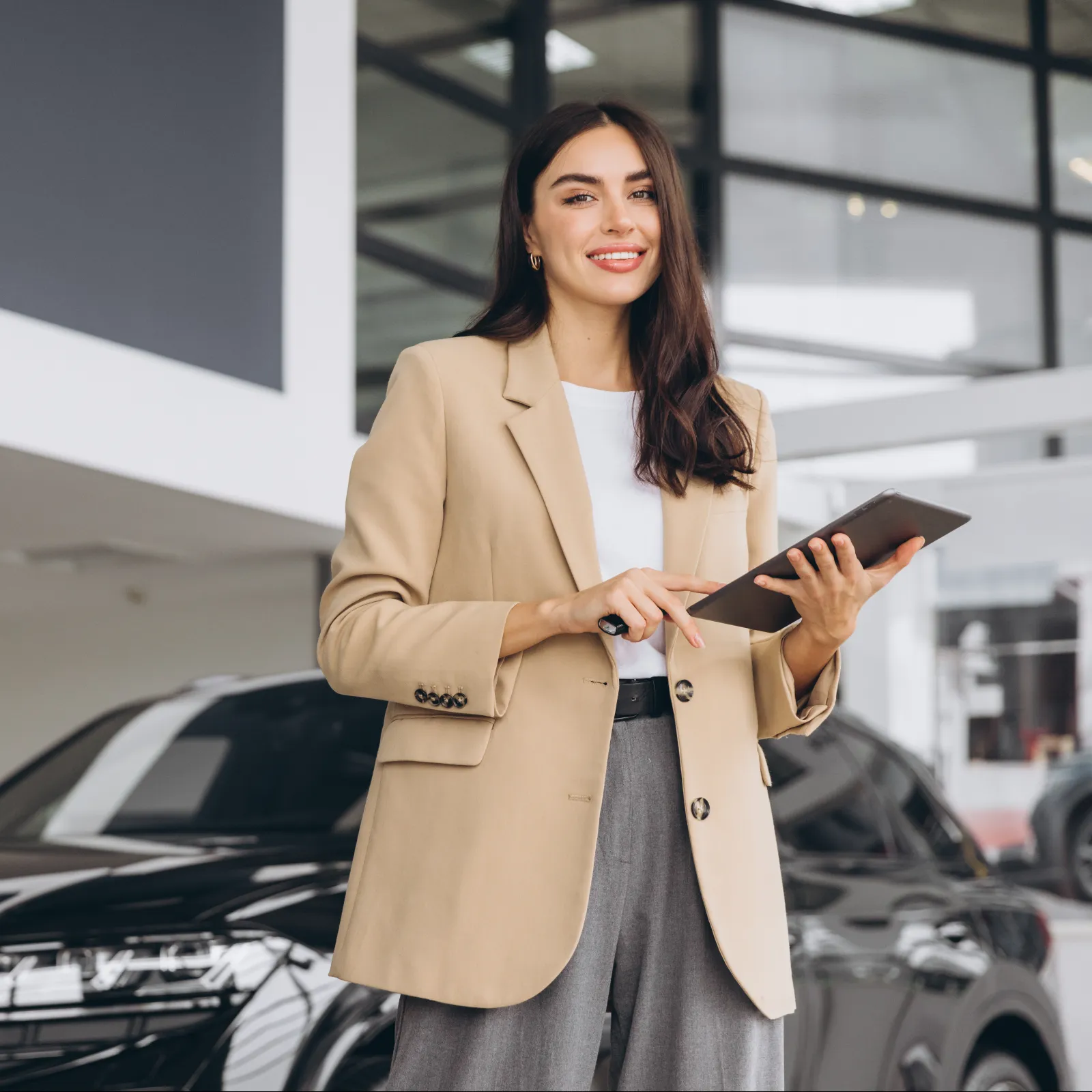 a woman holding a laptop