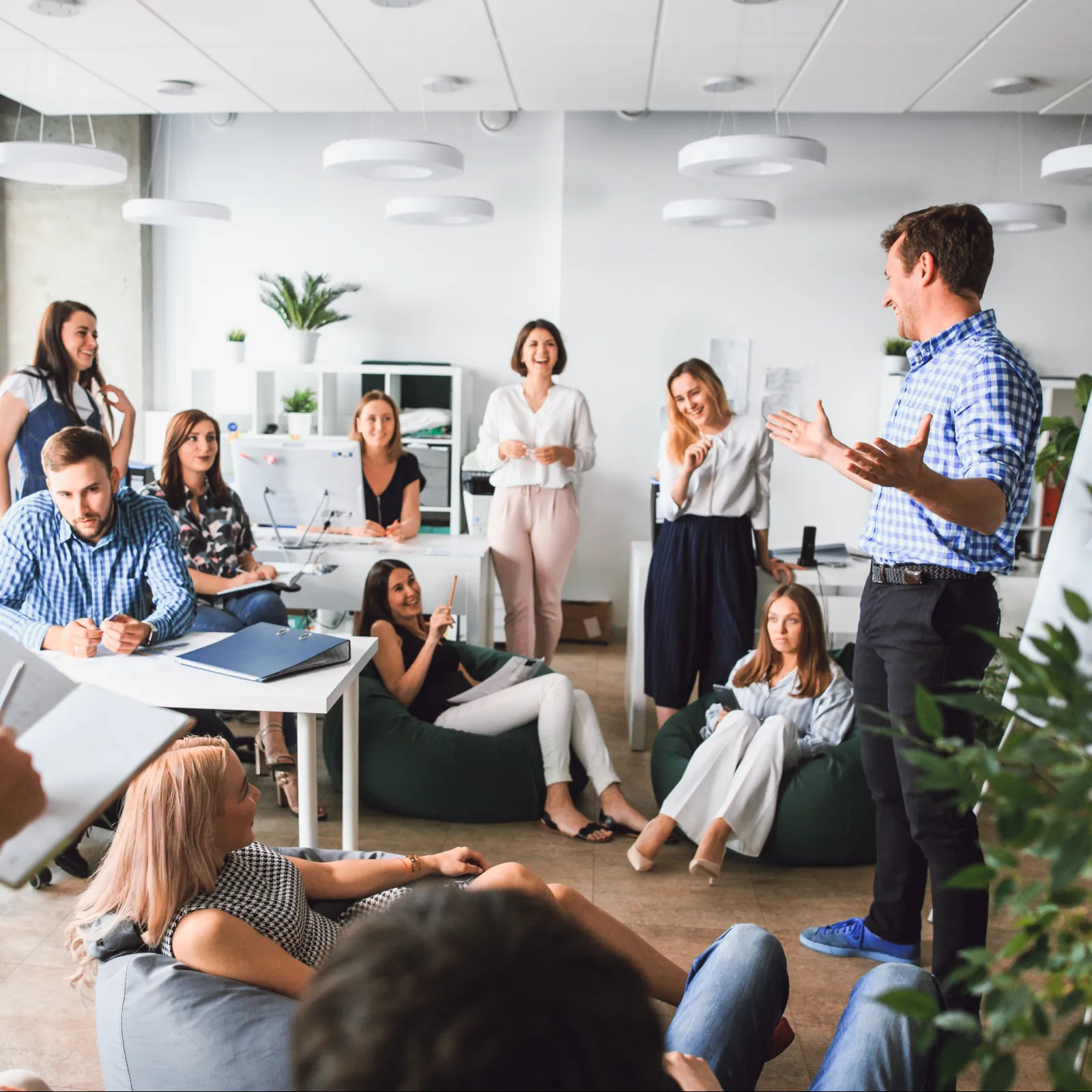 A team engages in a collaborative meeting in a modern office setting.