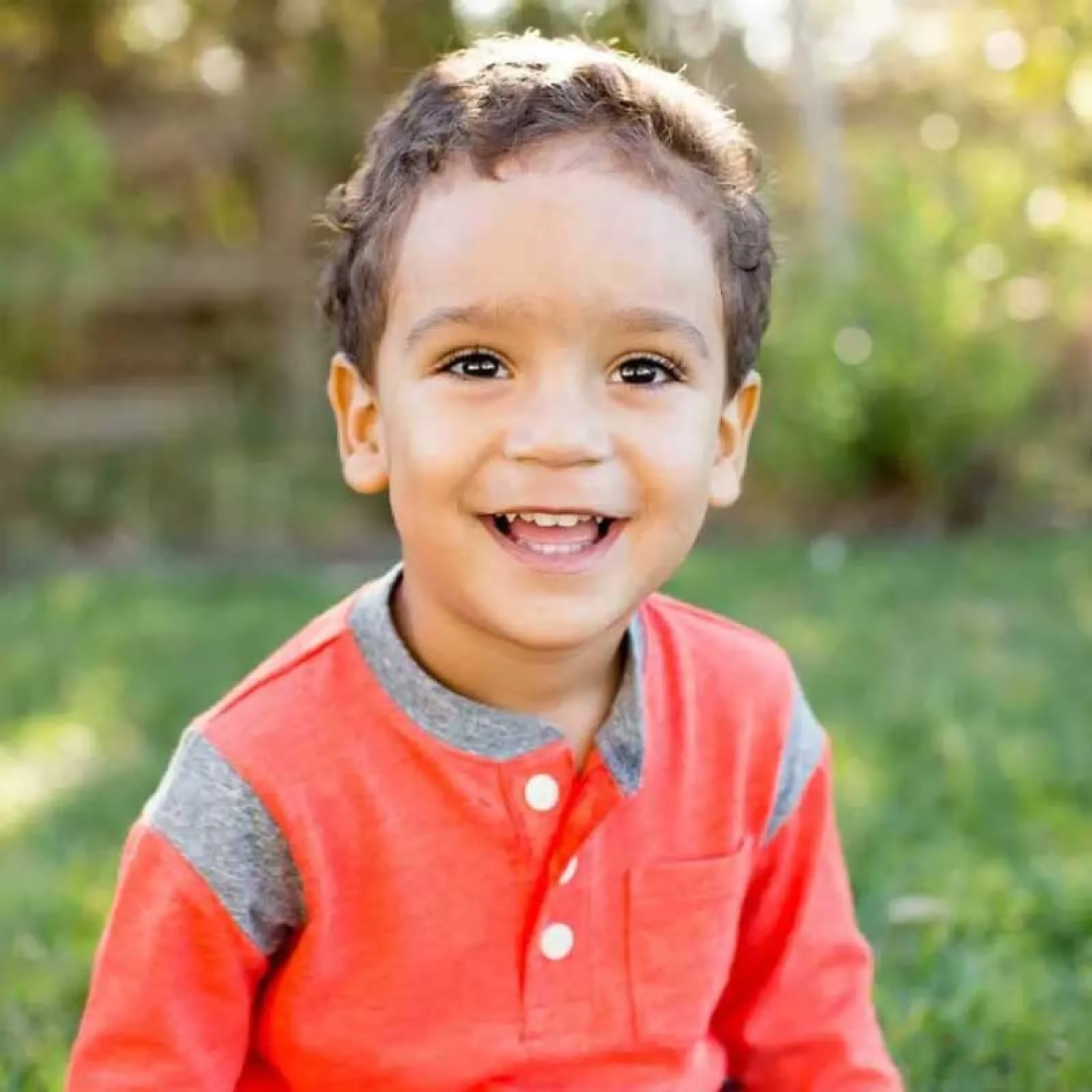 a boy smiling for the camera