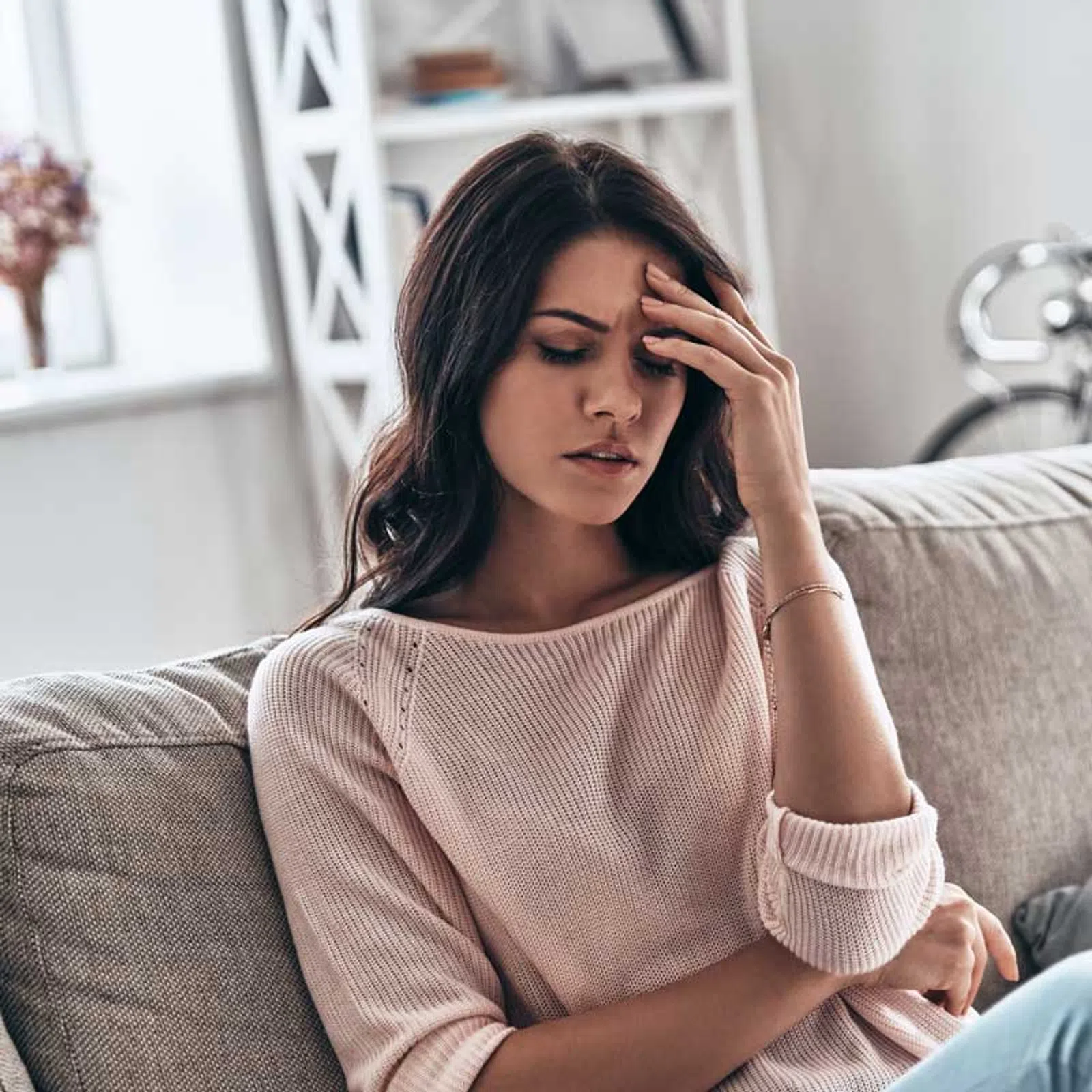 a woman sitting on a couch