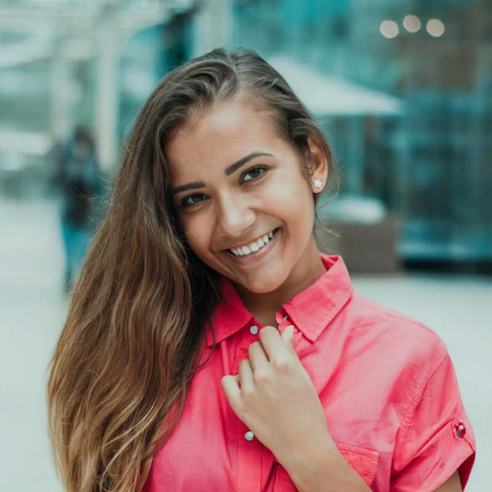 a person smiling and pointing