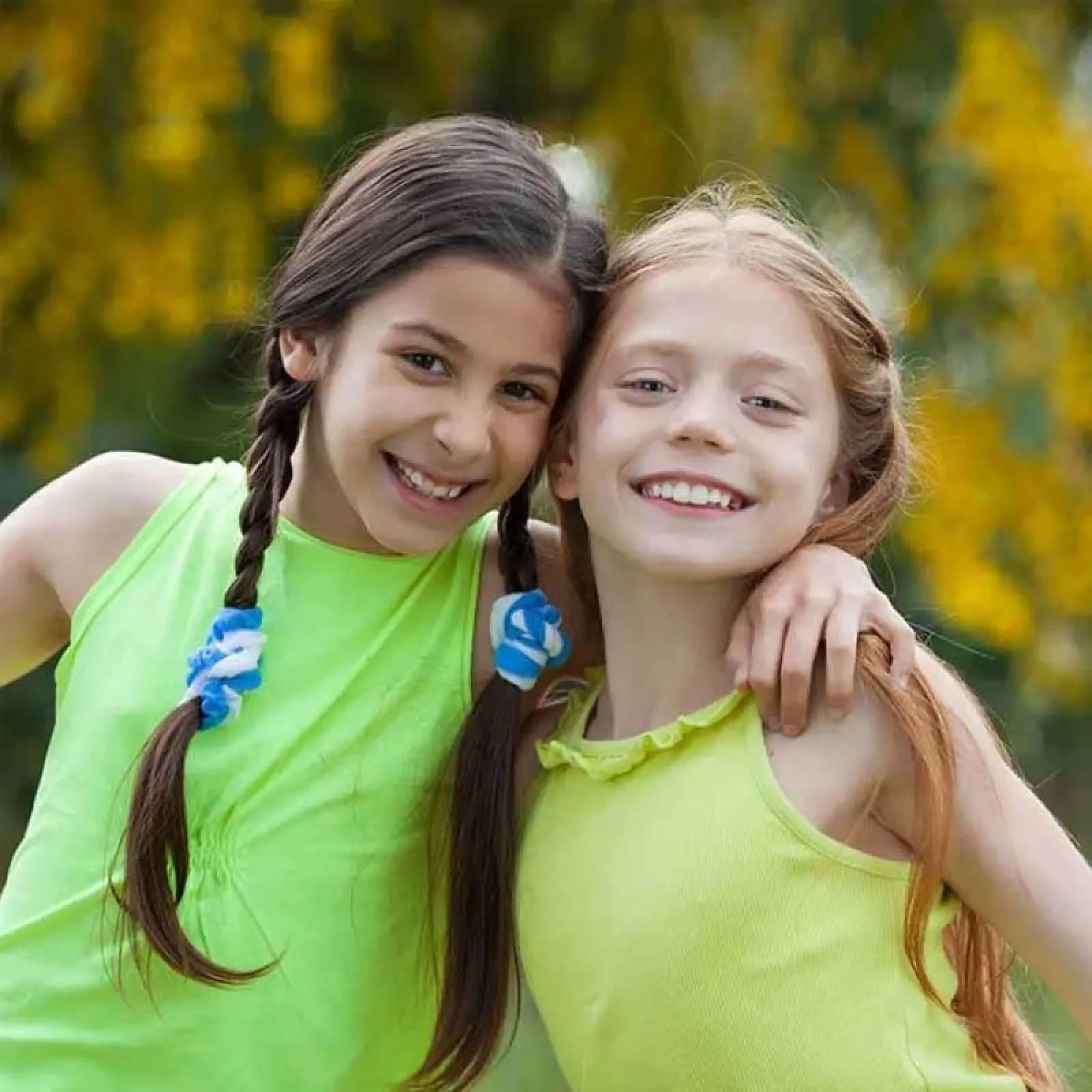 a couple of girls smiling